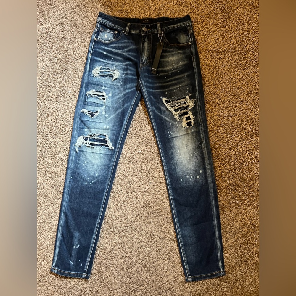 AMIRI Blue Distressed Skinny Jeans